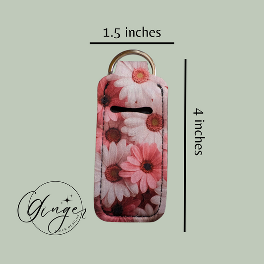 Floral keychain with dimensions on a light green background