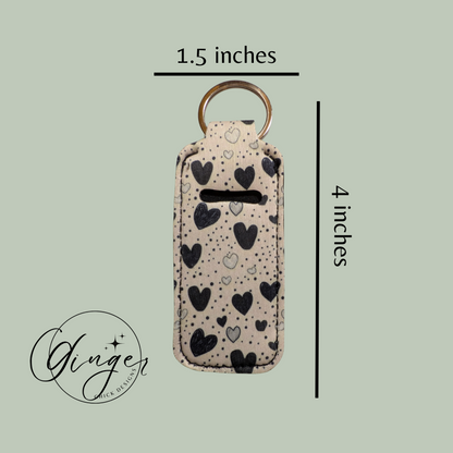 Keychain case with heart pattern and dimensions on a light green background