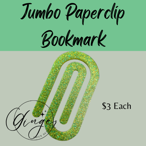 Green glittery paperclip bookmark on a light gray background with text indicating price and brand.