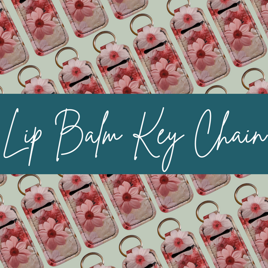 Pattern of lip balm key chains with floral design on a light green background.