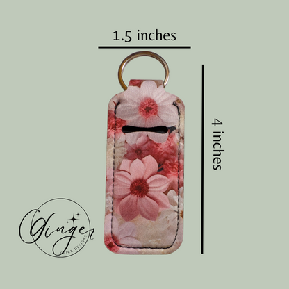 Floral keychain with dimensions on a light green background