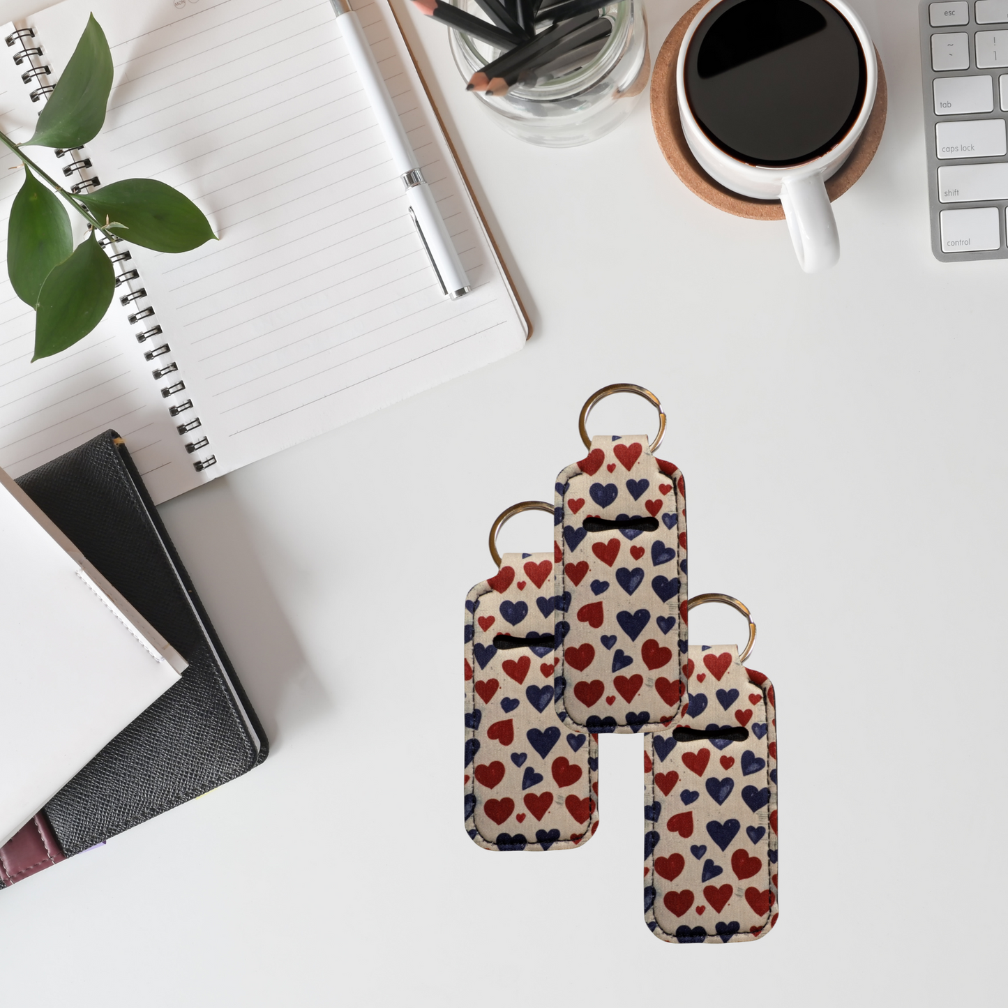 Keychain with heart pattern on a desk with office supplies