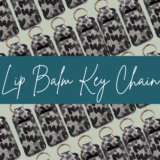 Lip balm key chains with camouflage pattern on a light green background