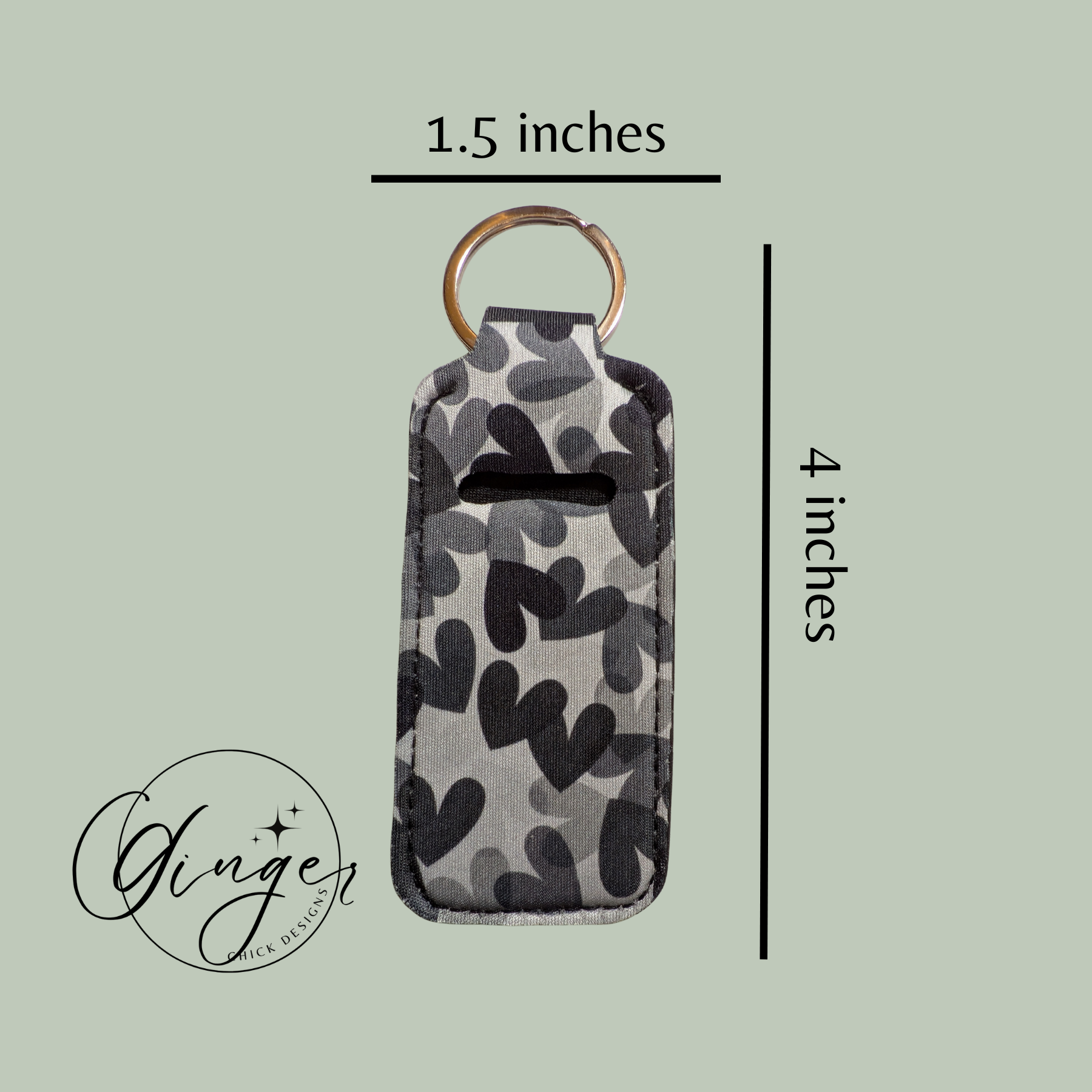Camouflage-patterned keychain with dimensions on a light green background