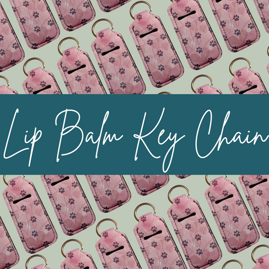 Pattern of pink lip balm keychains with paw prints on a green background, featuring text 'Lip Balm Key Chain'.