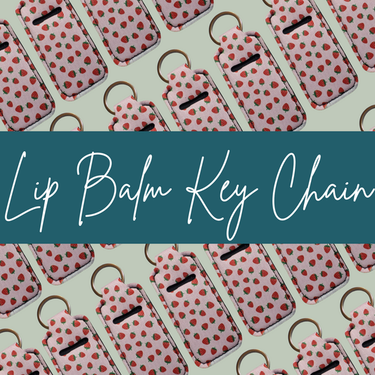 Lip balm key chains with strawberry pattern on a light green background